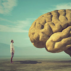 Person standing in front of a large brain